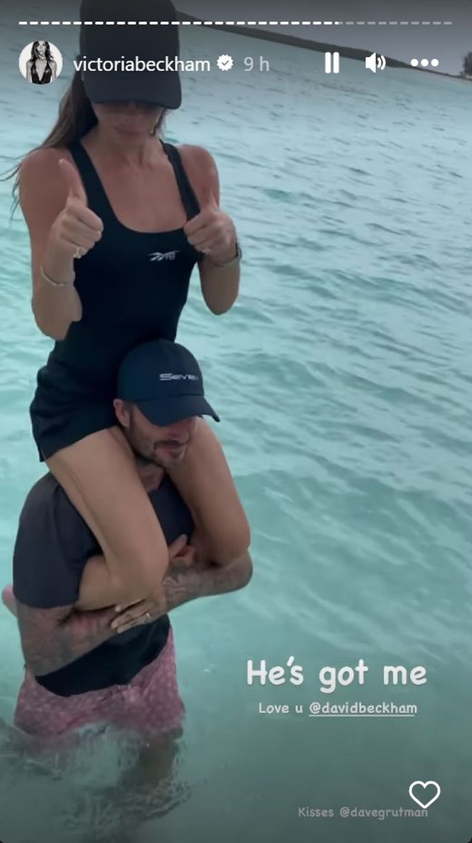 David Beckham proved to be a modern as he carried wife Victoria through the ocean