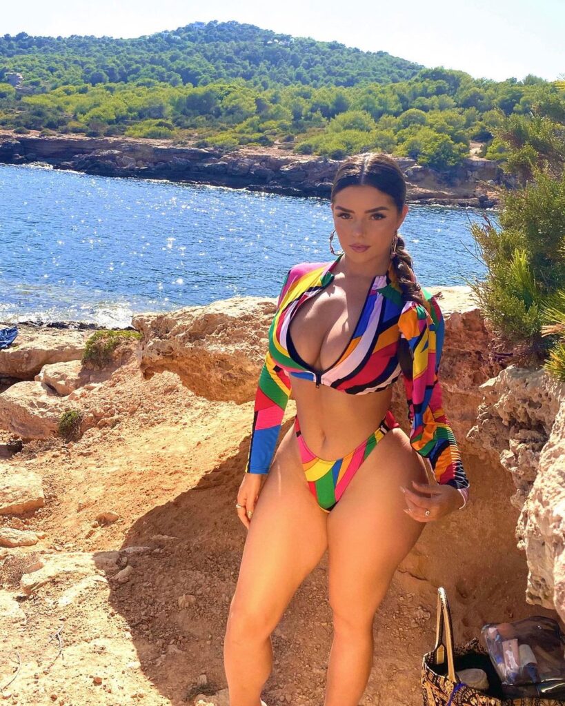 Demi Rose strikes a pose for the camera in a colorful two-piece.