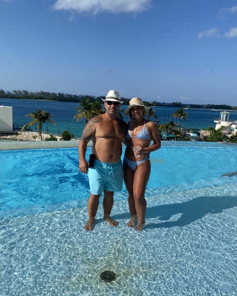 Joe Giudice posing with his daughter Gia by the pool.