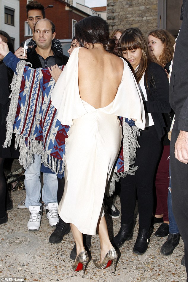 Selena Gomez goes braless in backless gown during European promo tour