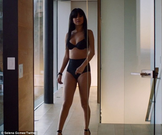 Daring to bare: Selena Gomez flashes some skin in black lingerie in a teaser for her upcoming Hands To Myself music video