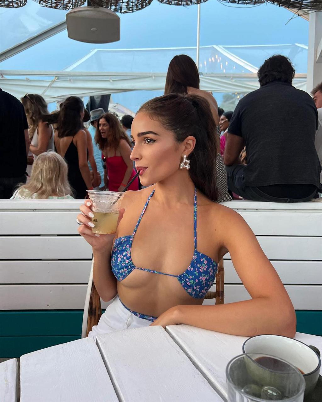 Olivia Culpo in a tiny bikini top