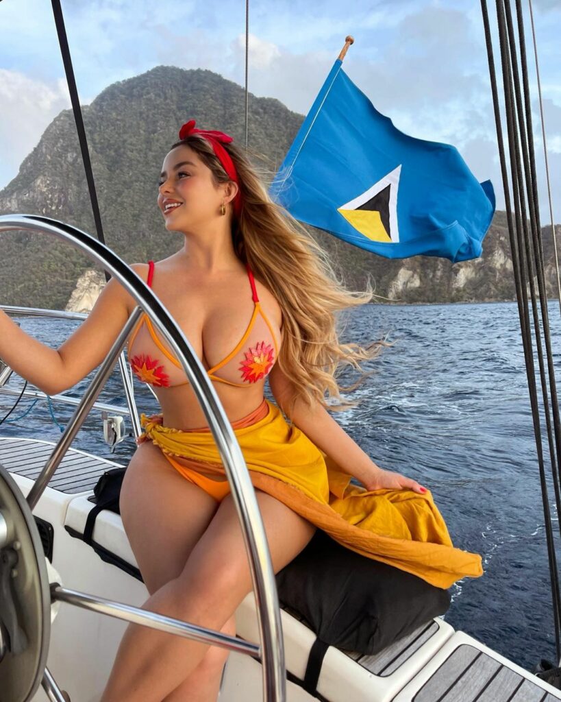 Demi Rose rides a yacht.