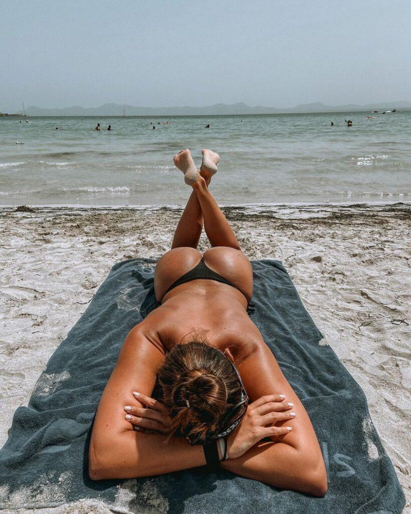 Alexandra Ianculescu basking in the sun at the beach.