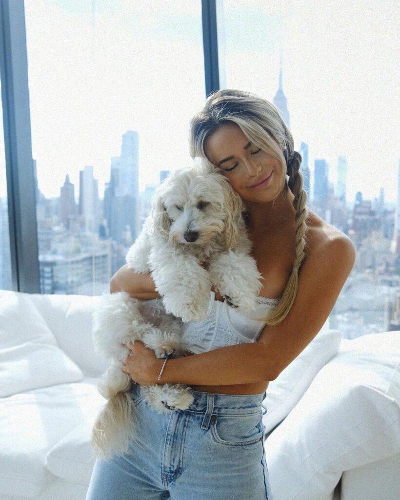 Emily Elizabeth hugging her dog.