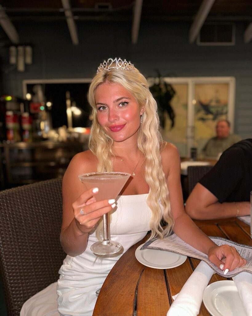 Hannah White wearing a white dress and a tiara at her birthday dinner.