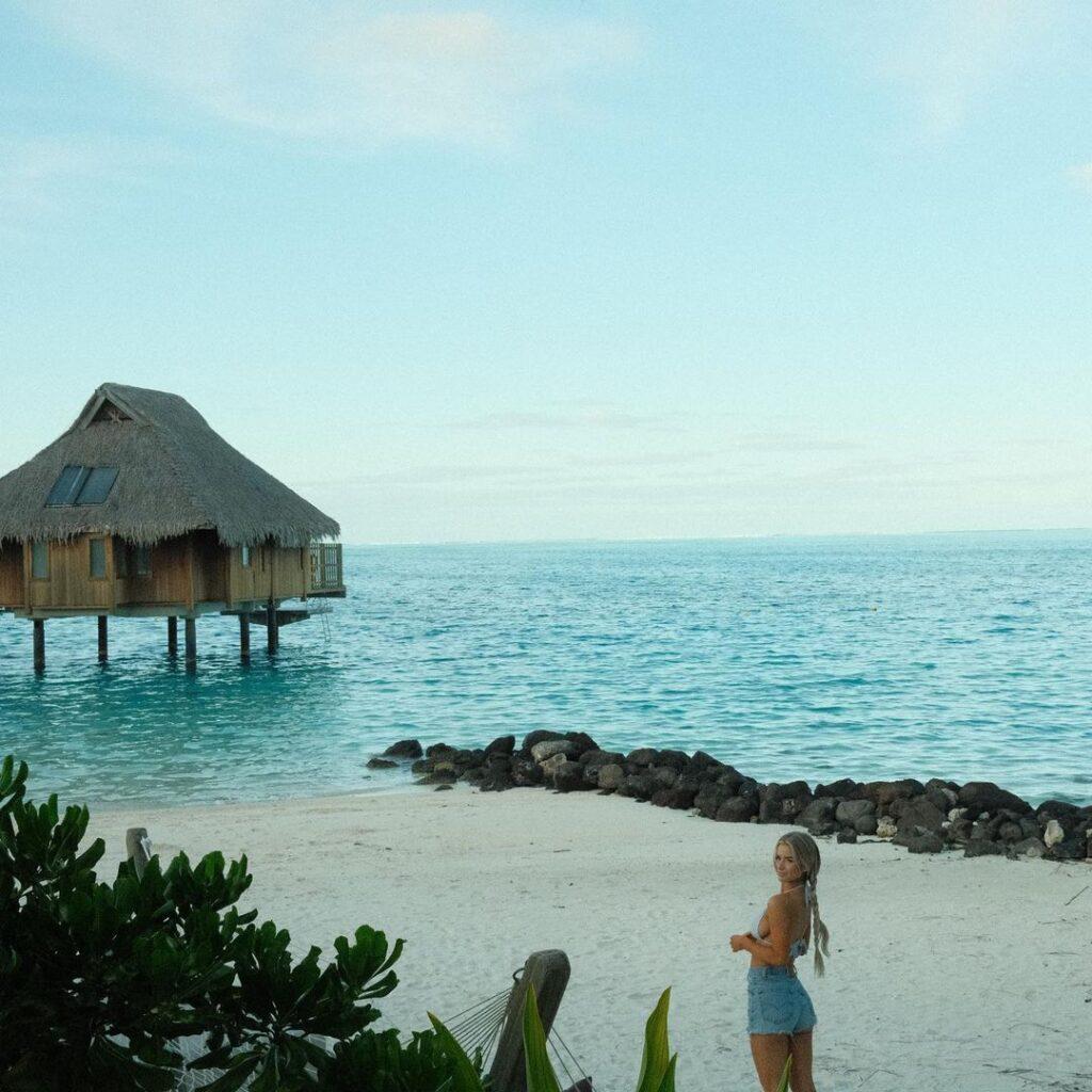 Emily Elizabeth standing at the beach.