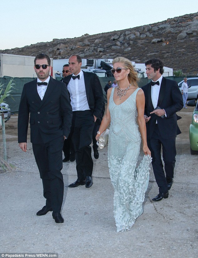 Strutting her stuff: Paris was at the forefront of a gang of suited and booted guests 