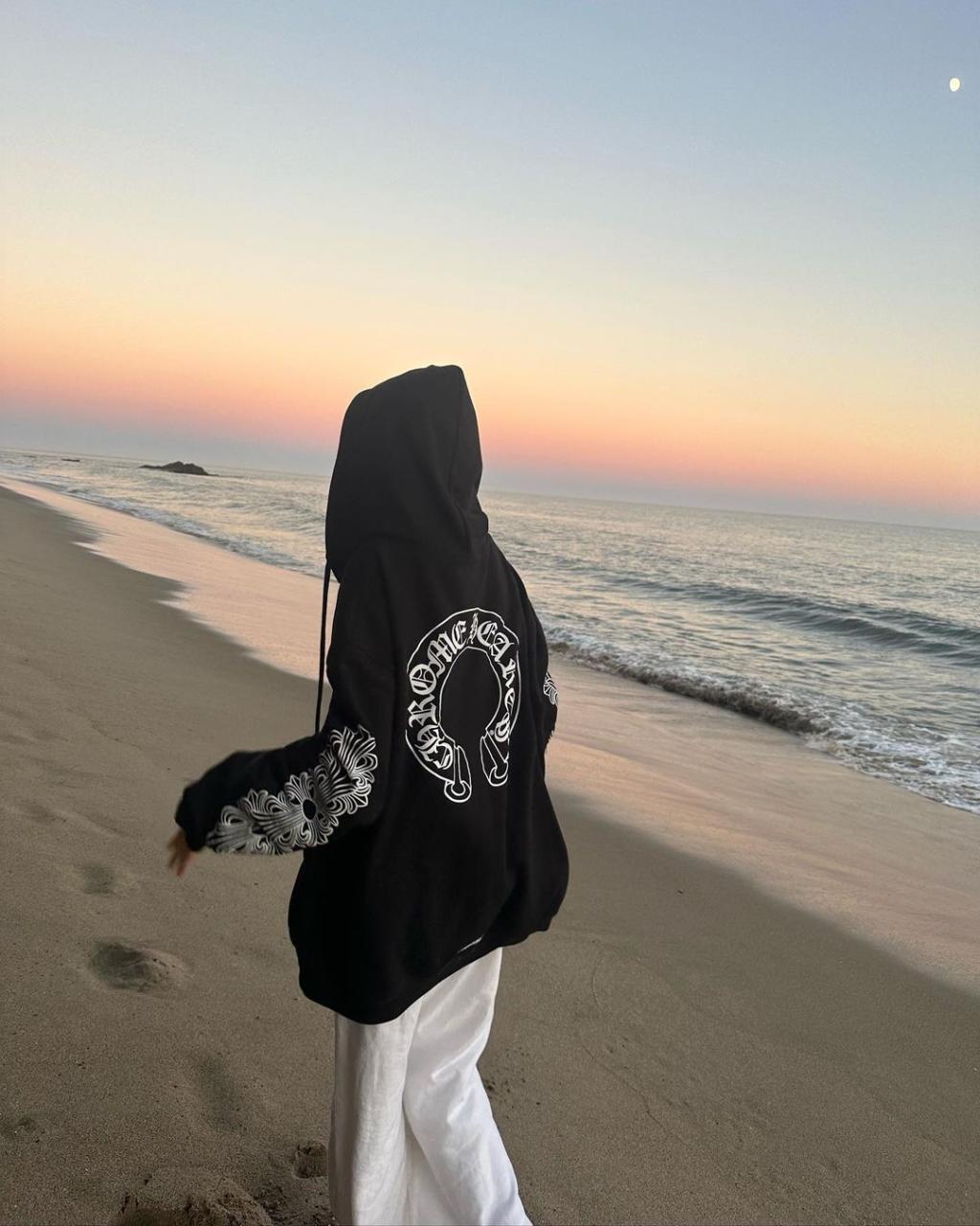 Sami Sheen poses in strapless bikini on the beach in Malibu