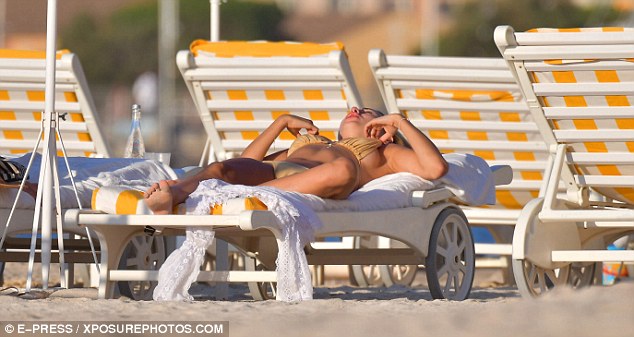 At ease! The former MIC star relaxed on a sunbed catching some rays in the South of France