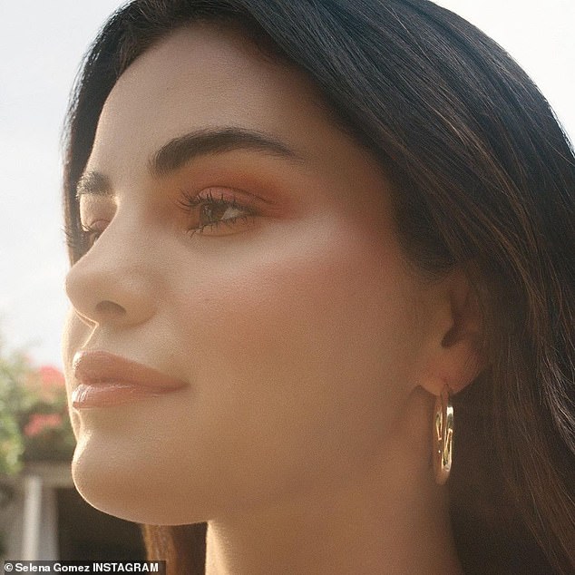 Own best advertisement: Gomez, who encouraged her 202million followers to check out the products for themselves, included a few promotional images and a stunning selfie