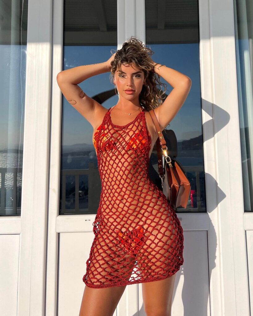 Zoe Gara poses under the sun in her crochet dress and bikini.