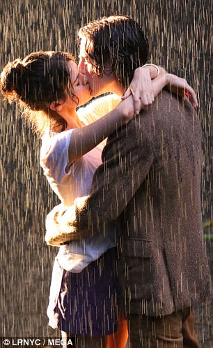 Locking lips: With adverse weather conditions in full swing, Selena and Timothee ensured all focus on each other as they kissed