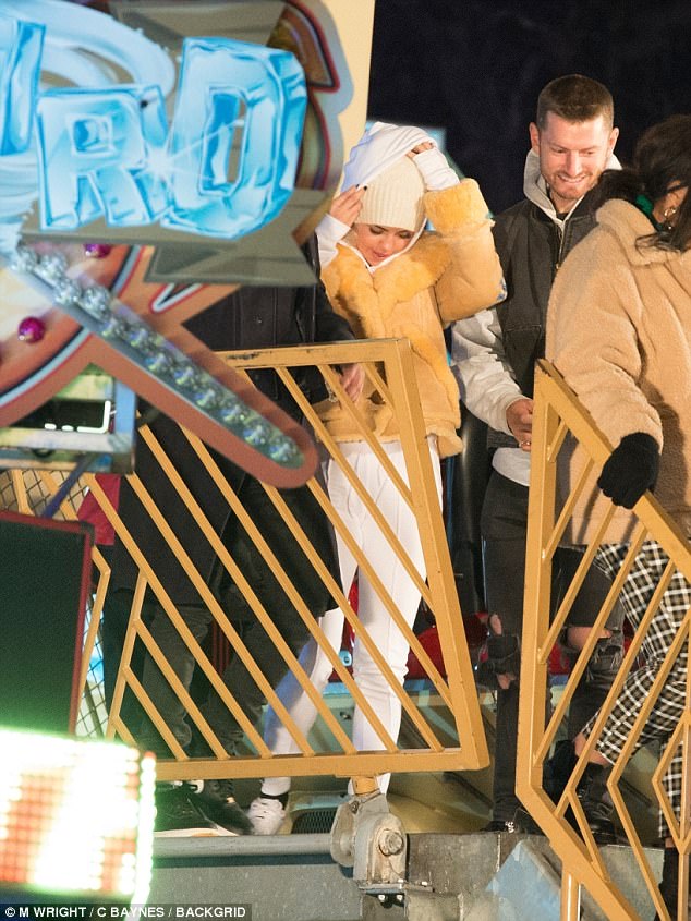 White out: Selena kept the white vibe throughout the rest of her cosy and casual ensemble, slipping into white Cotton Citizen sweats and hoodie, and matching lace-up sneakers