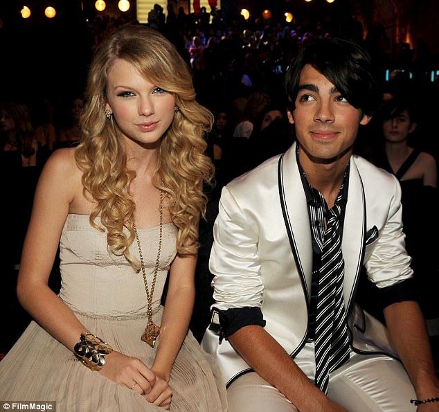 Rock stars: Taylor and Joe took their short-lived love affair to the MTV Video Awards in 2008