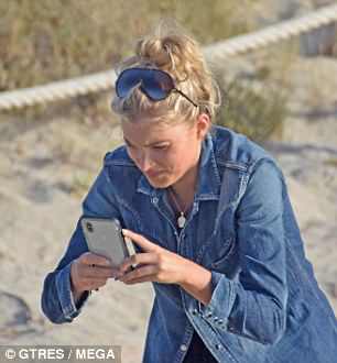 Snap happy: She happily took shots of her pal on her camera