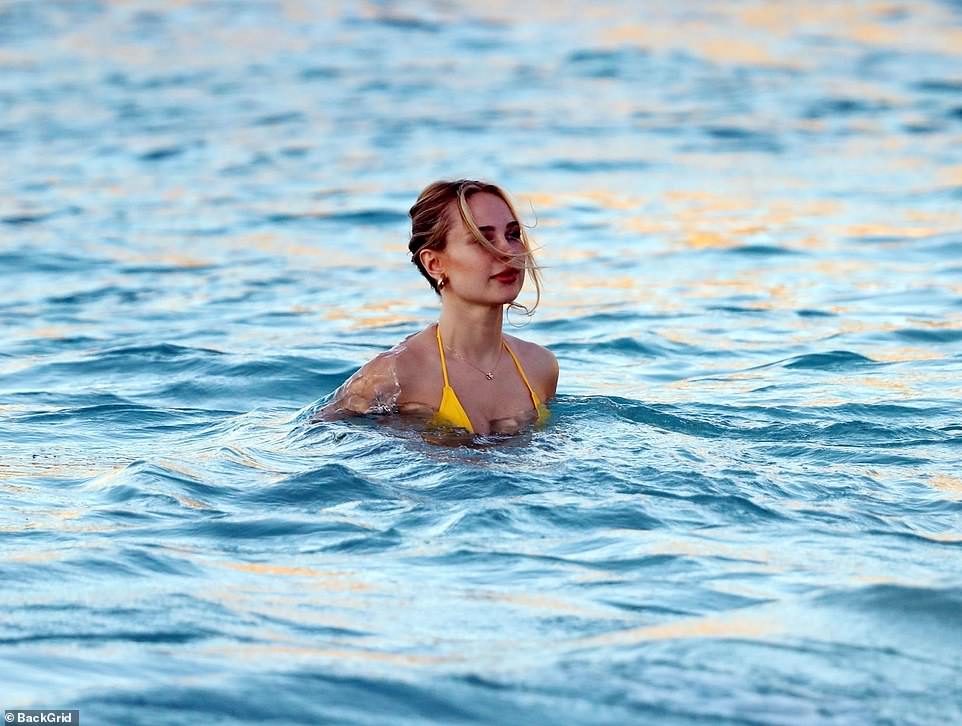 Taking a dip: She was soaking up the stunning surroundings