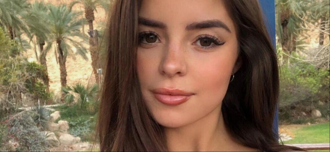 Demi Rose In Low-Cut Dress Heats Up Her Phone With A Busty Selfie