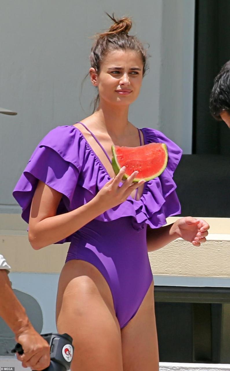 Delicious: Hill enjoyed a refreshing slice of watermelon during the shoot