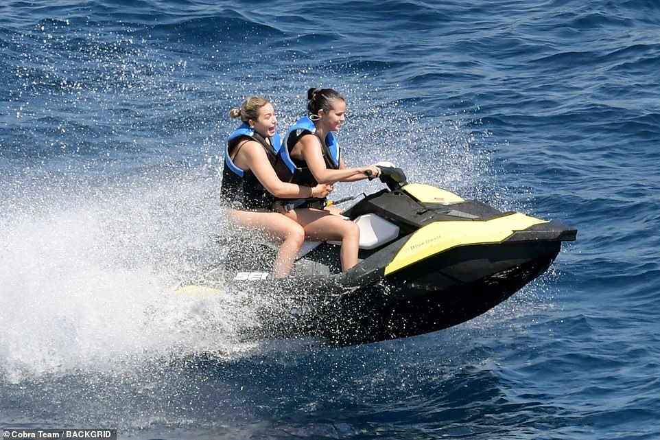 Impressive! Selena flashed a massive grin as she drove a jet ski with her friend during the luxury day out