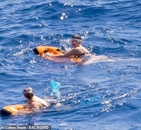 Snorkeling: The pals tried to see if they could see any fish as they wore snorkels