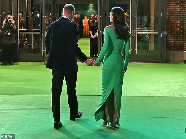 The royal couple put on a public display of affection earlier in the night, briefly holding hands as they walked into the MGM Music Hall at Fenway