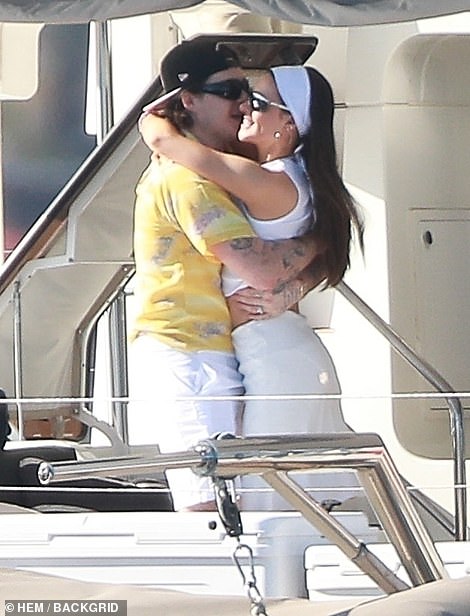 Loved up: Brooklyn and Nicola still looked very much in the honeymoon phase as they embraced