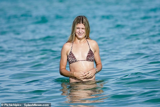 Bouchard enjoys the warm winter sun at a beach in Miami after bombing out of Australian Open qualifying in Melbourne