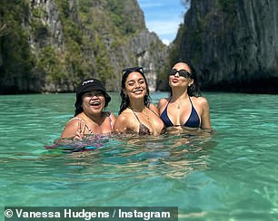 Making memories: Another photo showed Hudgens posing in between a close friend on the left and her younger sibling on the right as they took a few memorable snaps together