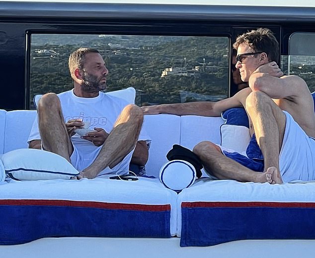 Tom Brady was pictured having a 'coffe talk' with David Grutman in Sardinia on Tuesday