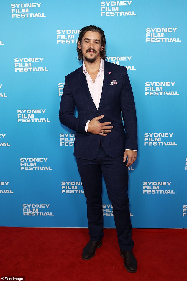 Home and Away star Brenton Thwaites (pictured) was dapper in a slim fit navy blue suit with a white dress shirt and pocket square