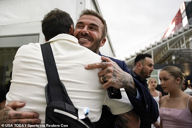 Beaming: He appeared in great spirits as he stepped out of his car and greeted guests with a handshake