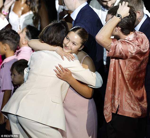 My girl: Harper's pink dress was a nod to the team's colours