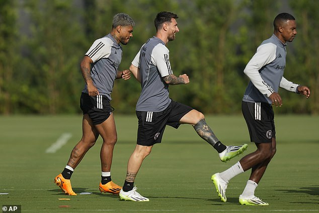 Messi warming up with forward Josef Martinez, left, and midfielder Dixon Arroyo on Monday