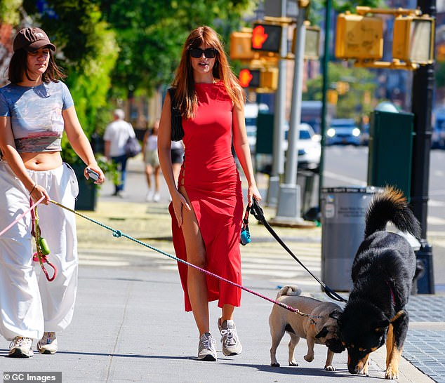 Gorgeous: Emily, who dyed her brown hair red earlier this month, wore her locks loose around