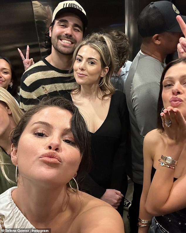 Striking a pose: To conclude the post, Selena also shared a selfie she had taken with a group of her friends as they all struck a pose for the camera