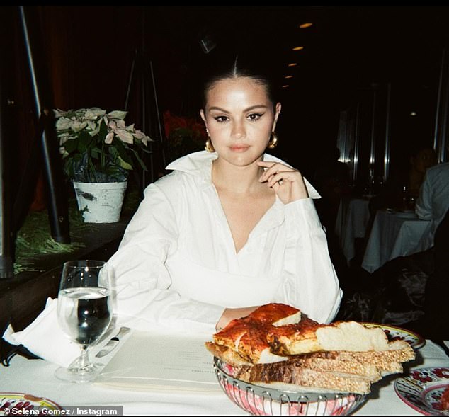 Stunning: The second image was taken as the beauty struck a quick pose while sitting inside of a restaurant