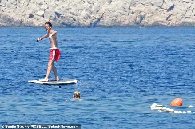 Having a blast: Cruz appeared to be having a great time on his electric surfboard