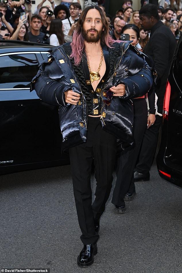 Dapper: Also making an entrance, Jared Leto cut a stylish figure in a black padded vest with gold embossed buttons running down the middle