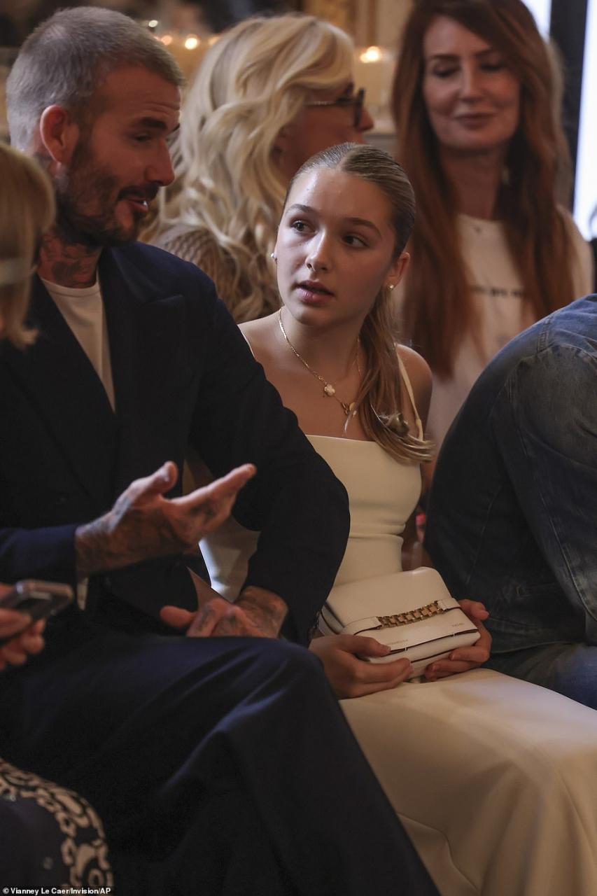 Fashion set: David was seen sitting alongside his very chic looking daughter Harper, 12, who donned a fashionable white dress