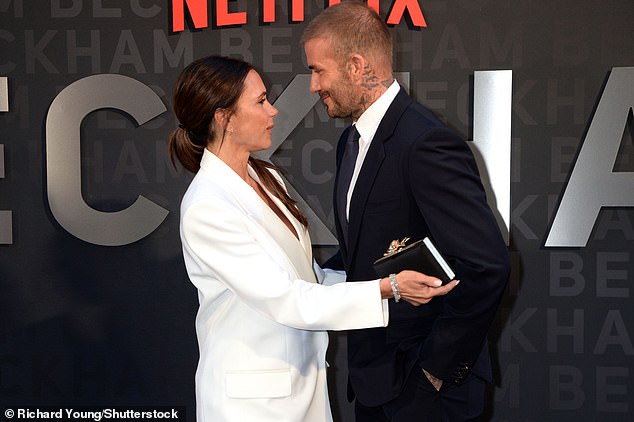 Power couple: David and Victoria looked as close as ever as they shared a sweet hug in one intimate moment on the carpet as they showed their support for each other