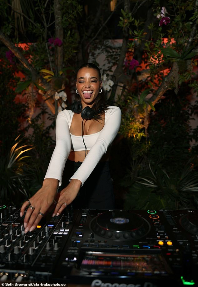 Beaming: Ella Balinska put on an animated display as she DJ'd