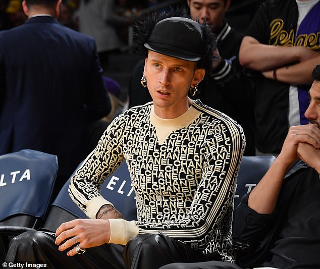 Multiple earrings: Colson Baker, aka Machine Gun Kelly, also accessorized with multiple earrings as well as several nose rings for the game