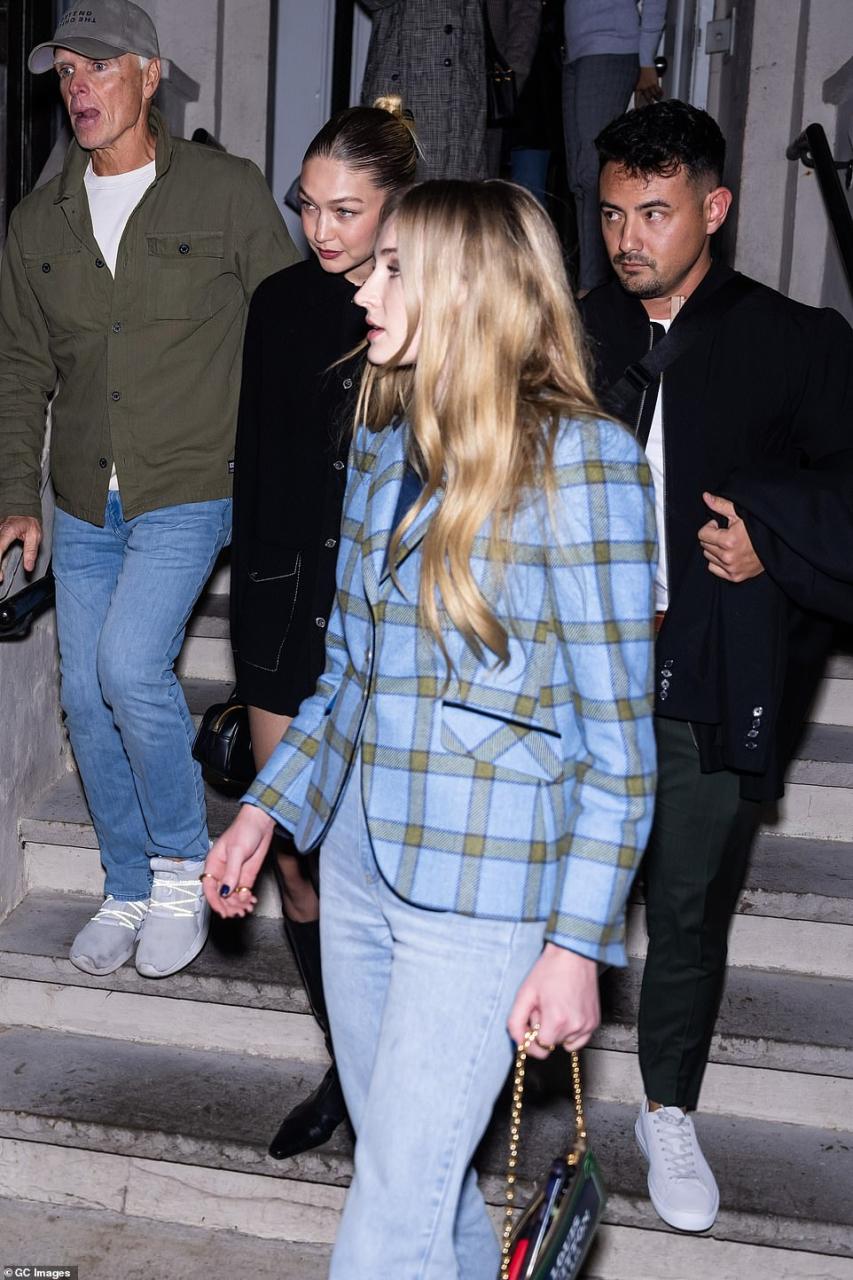 Staying close together: Sophie also added a variety of flashy rings on her right hand to accessorize her look for the night