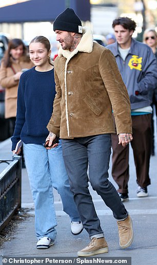 David looked stylish as ever in a suede shearling jacket, which he styled with dark jeans, a navy beanie and a pair of suede lace-up shoes