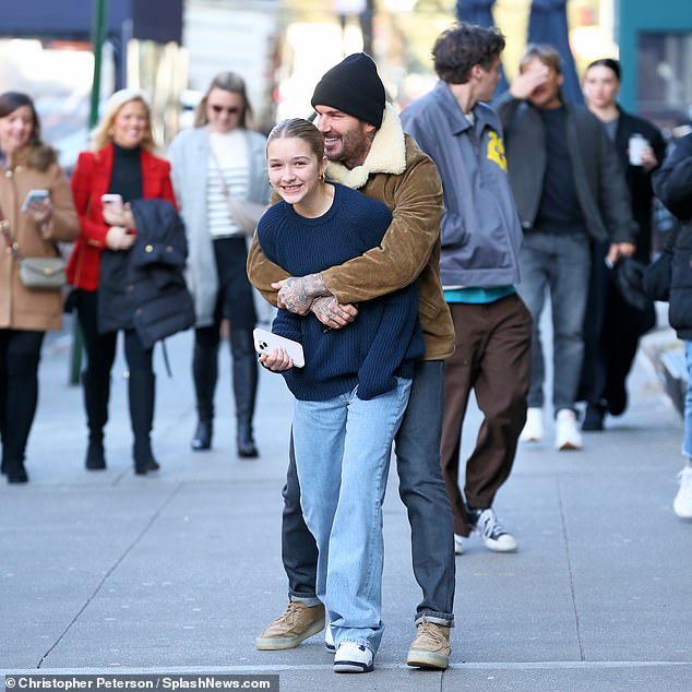 Cruz wore a stylish grey jacket, which he styled with a T-shirt and a pair of brown trousers and Converse trainers