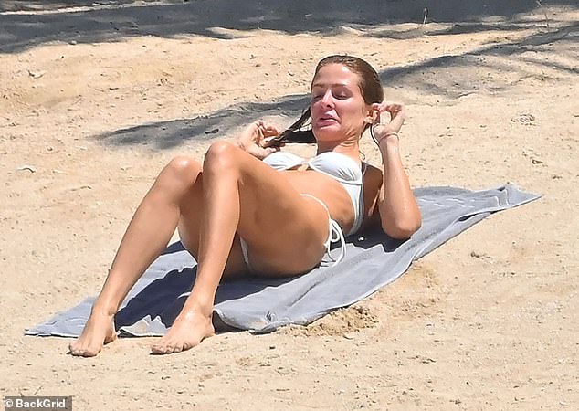 Millie Mackintosh showcases her jaw-dropping figure in a sexy cream bikini while husband Hugo Taylor flaunts his buff body in Mauritius