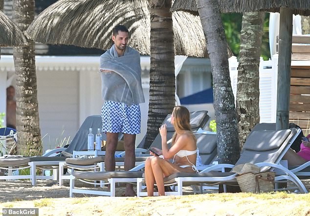 Millie Mackintosh showcases her jaw-dropping figure in a sexy cream bikini while husband Hugo Taylor flaunts his buff body in Mauritius