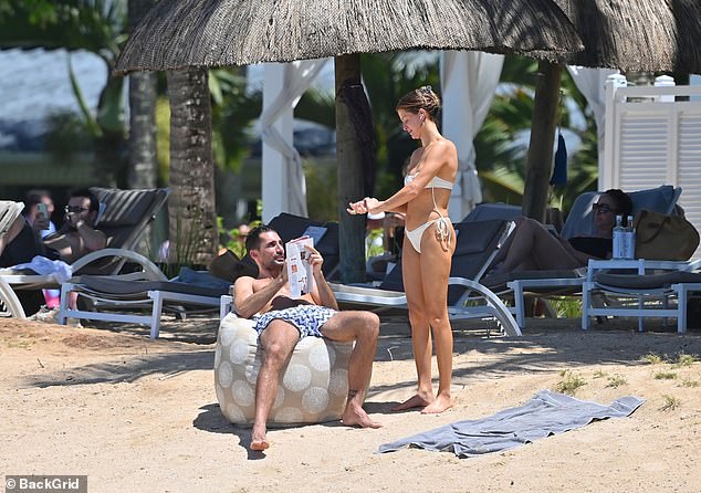 Millie Mackintosh showcases her jaw-dropping figure in a sexy cream bikini while husband Hugo Taylor flaunts his buff body in Mauritius