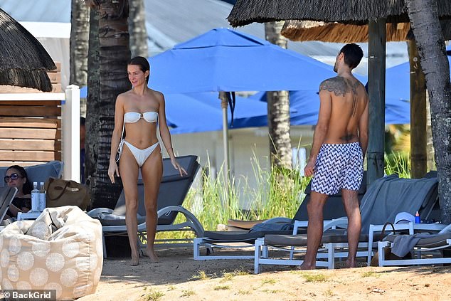 Millie Mackintosh showcases her jaw-dropping figure in a sexy cream bikini while husband Hugo Taylor flaunts his buff body in Mauritius